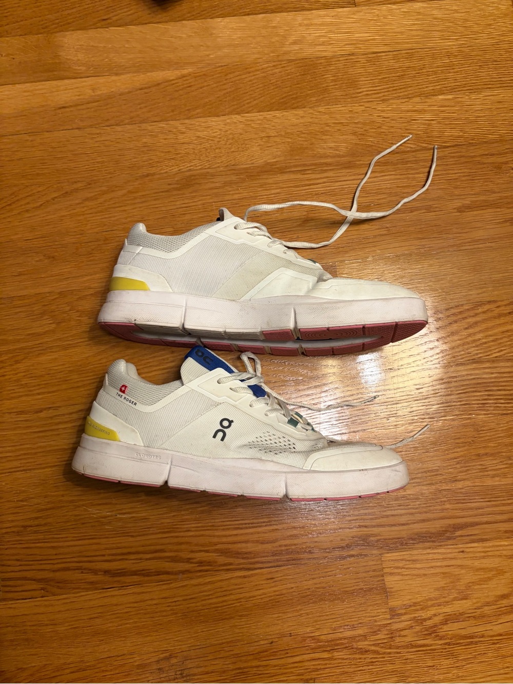 On Running Roger White Sneakers with Yellow and Blue Accents